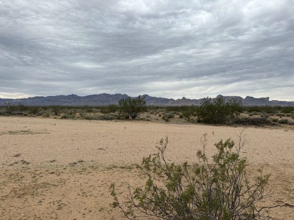 Gravel lot with orange stakes at RV Safe Site, overnight RV parking near Kingman in Golden Valley, AZ